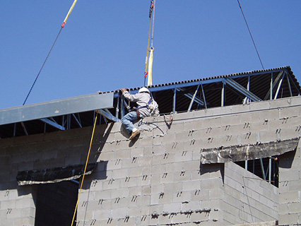 man securing roof section