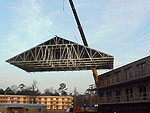 Roof sections are crane lifted